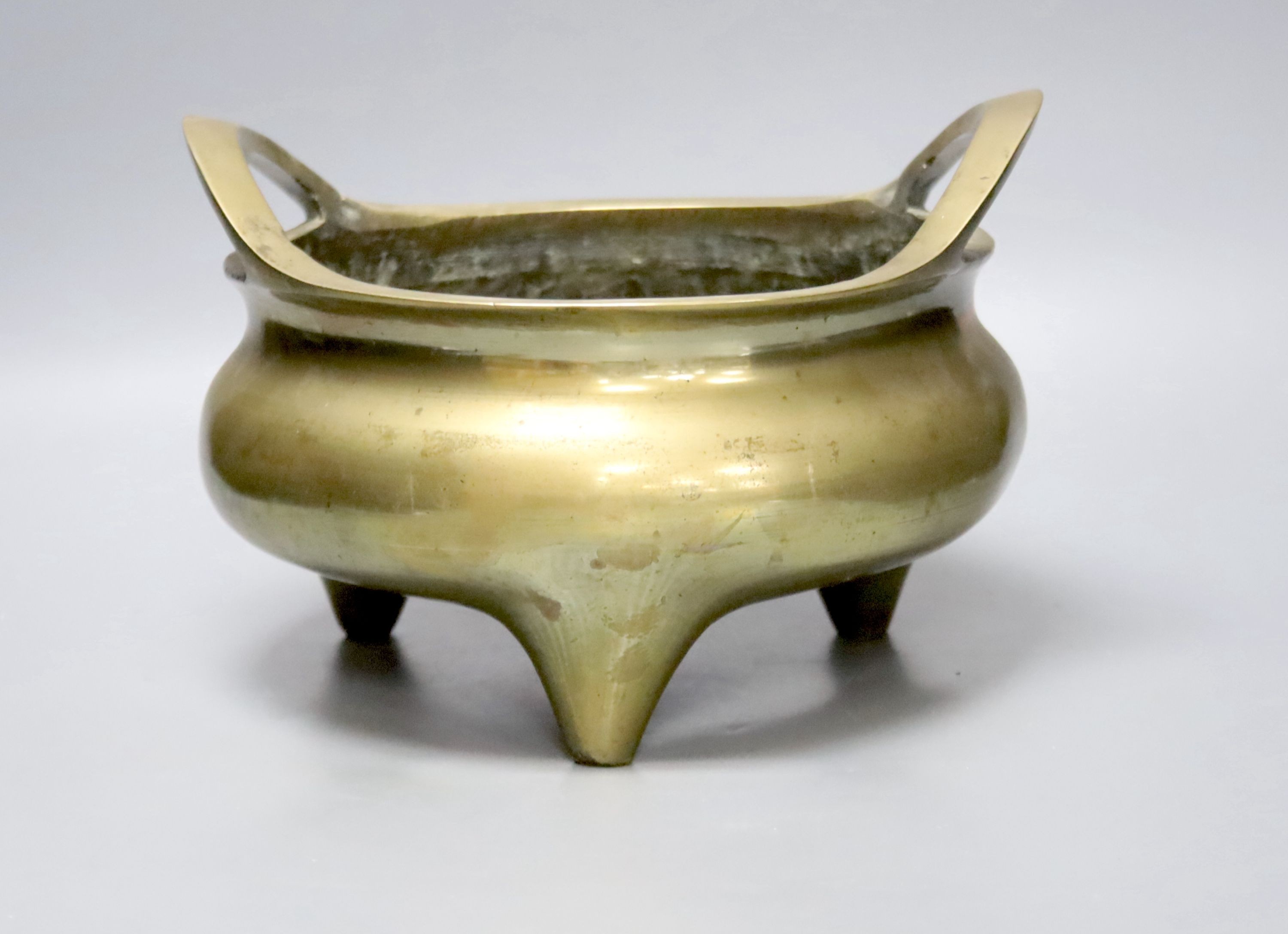 A large Chinese bronze tripod censer Xuande mark, early 20th century, 25cm wide